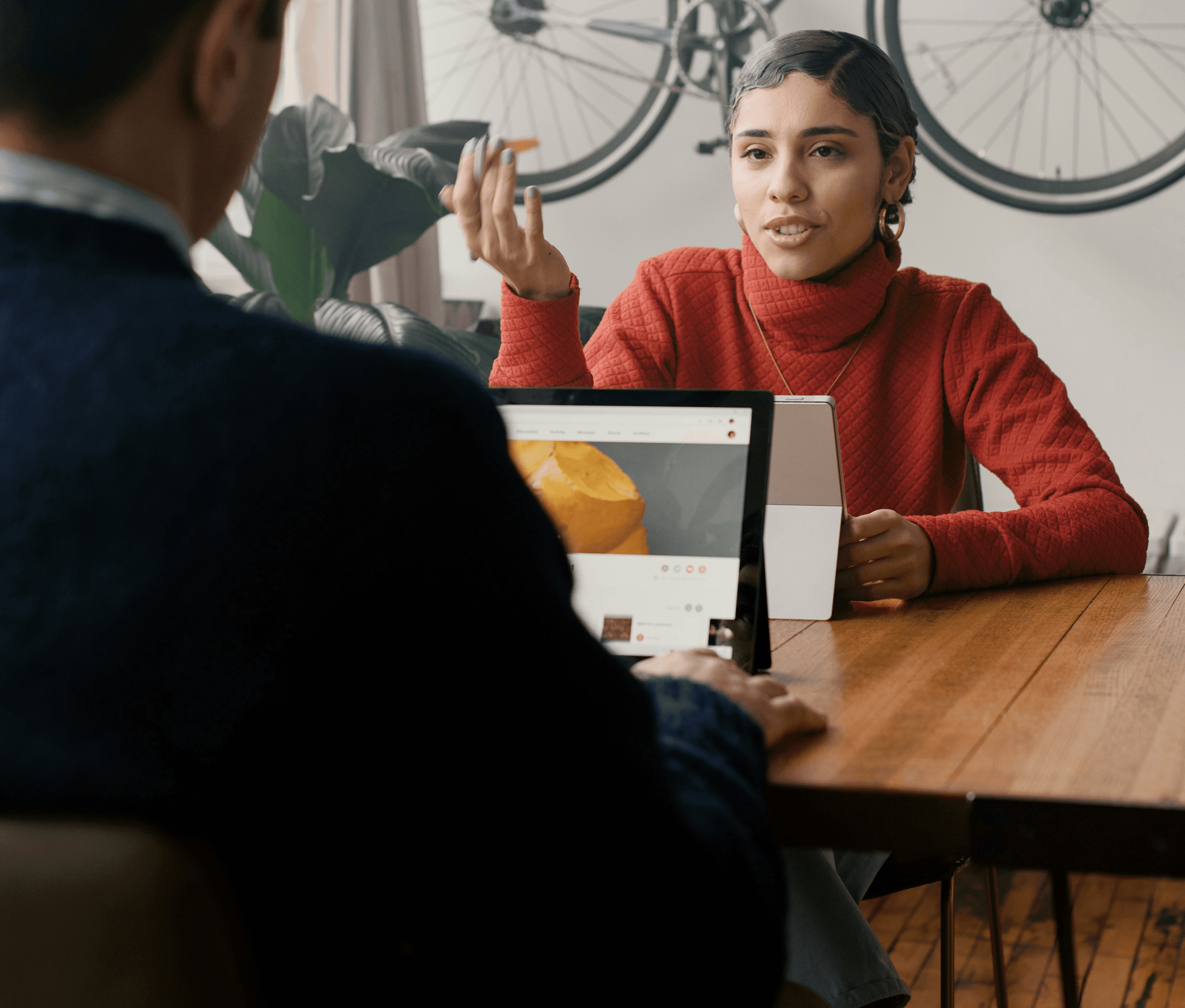 Woman in yellow sweater in modern office setting